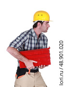 Man running off with tool box. Стоковое фото, агентство Ingram Publishing / Фотобанк Лори