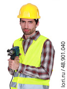 Portrait of a frowning tradesman. Стоковое фото, агентство Ingram Publishing / Фотобанк Лори
