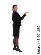 Woman standing holding invisible object. Стоковое фото, агентство Ingram Publishing / Фотобанк Лори