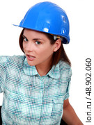 An unhappy female manual worker. Стоковое фото, агентство Ingram Publishing / Фотобанк Лори