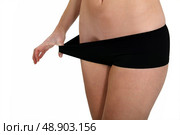 woman in black panties after losing weight. Стоковое фото, агентство Ingram Publishing / Фотобанк Лори