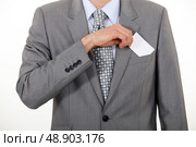 Businessman taking out business card. Стоковое фото, агентство Ingram Publishing / Фотобанк Лори