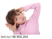 Young girl making faces. Стоковое фото, агентство Ingram Publishing / Фотобанк Лори