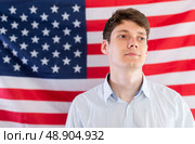 Young guy posing in front of USA flag. Стоковое фото, фотограф Татьяна Яцевич / Фотобанк Лори