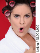 Angry woman with her hair in rollers. Стоковое фото, агентство Ingram Publishing / Фотобанк Лори
