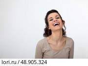 Gorgeous woman laughing out loud. Стоковое фото, агентство Ingram Publishing / Фотобанк Лори