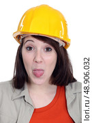 Construction worker sticking her tongue out. Стоковое фото, агентство Ingram Publishing / Фотобанк Лори
