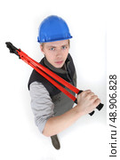 Menacing tradesman holding large clippers. Стоковое фото, агентство Ingram Publishing / Фотобанк Лори