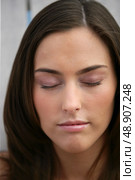 Beautiful woman with her eyes closed. Стоковое фото, агентство Ingram Publishing / Фотобанк Лори