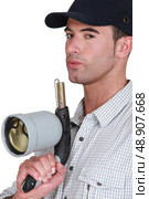 Man with blowtorch. Стоковое фото, агентство Ingram Publishing / Фотобанк Лори