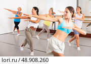 Group of active women practicing energetic dance in a studio. Стоковое фото, фотограф Яков Филимонов / Фотобанк Лори