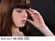 Woman suffering from headache. Стоковое фото, агентство Ingram Publishing / Фотобанк Лори
