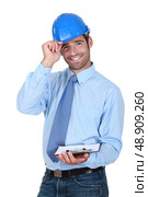 Friendly chap with a clipboard and helmet. Стоковое фото, агентство Ingram Publishing / Фотобанк Лори