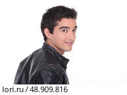 Young man in a leather jacket. Стоковое фото, агентство Ingram Publishing / Фотобанк Лори