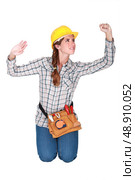 Tradeswoman confined by a transparent wall. Стоковое фото, агентство Ingram Publishing / Фотобанк Лори