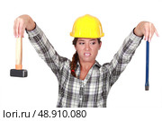 Revolted woman looking at her tools. Стоковое фото, агентство Ingram Publishing / Фотобанк Лори