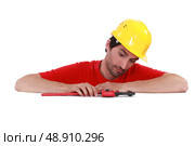 Man with a pipe wrench. Стоковое фото, агентство Ingram Publishing / Фотобанк Лори