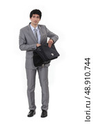 Businessman routing through bag. Стоковое фото, агентство Ingram Publishing / Фотобанк Лори