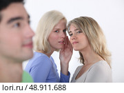 Girls criticizing boy. Стоковое фото, агентство Ingram Publishing / Фотобанк Лори