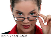 secretary with glasses lowered on her nose. Стоковое фото, агентство Ingram Publishing / Фотобанк Лори