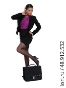 Sexy businesswoman with a briefcase. Стоковое фото, агентство Ingram Publishing / Фотобанк Лори