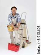 Carpenter with equipment, studio shot. Стоковое фото, агентство Ingram Publishing / Фотобанк Лори
