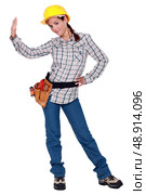 A female manual worker making a stop sign. Стоковое фото, агентство Ingram Publishing / Фотобанк Лори