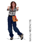 woman electrician who got an electrical shock. Стоковое фото, агентство Ingram Publishing / Фотобанк Лори