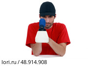Tradesman holding a spray gun. Стоковое фото, агентство Ingram Publishing / Фотобанк Лори
