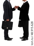 Two businessmen bumping fists. Стоковое фото, агентство Ingram Publishing / Фотобанк Лори