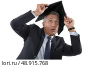 Businessman running outside in the rain. Стоковое фото, агентство Ingram Publishing / Фотобанк Лори