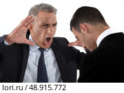 Boss shouting at useless employee. Стоковое фото, агентство Ingram Publishing / Фотобанк Лори