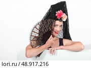 Woman in Spanish senora costume. Стоковое фото, агентство Ingram Publishing / Фотобанк Лори