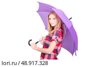 Pretty young woman under a bright purple umbrella. Стоковое фото, агентство Ingram Publishing / Фотобанк Лори