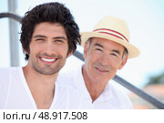 Father and son on holiday together. Стоковое фото, агентство Ingram Publishing / Фотобанк Лори
