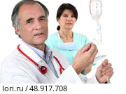 A doctor and a nurse. Стоковое фото, агентство Ingram Publishing / Фотобанк Лори