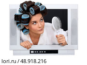 Woman escaping from television. Стоковое фото, агентство Ingram Publishing / Фотобанк Лори