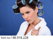 bad tempered woman with curlers in her hair. Стоковое фото, агентство Ingram Publishing / Фотобанк Лори