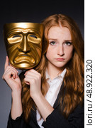 Woman with mask in hypocrisy concept. Стоковое фото, агентство Ingram Publishing / Фотобанк Лори