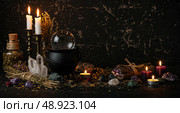 A witchy still life made on a dark surface and representing occult magic and spiritual esoteric practice. Celebrating Halloween and Samhain. Стоковое AI-изображение, AI-художник Анжелика Самсонова / Фотобанк Лори
