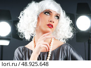 Young attractive girl with in the studio shooting. Стоковое фото, агентство Ingram Publishing / Фотобанк Лори