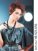 Young attractive girl with in the studio shooting. Стоковое фото, агентство Ingram Publishing / Фотобанк Лори
