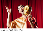 Actor with maks in a funny theater concept. Стоковое фото, агентство Ingram Publishing / Фотобанк Лори