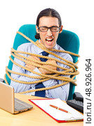 Young businessman tied with rope. Стоковое фото, агентство Ingram Publishing / Фотобанк Лори