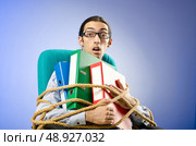 Young businessman tied with rope. Стоковое фото, агентство Ingram Publishing / Фотобанк Лори