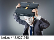 Industrial espionate concept with masked businessman. Стоковое фото, агентство Ingram Publishing / Фотобанк Лори