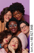 Six women of different ethnicities are smiling and posing together in a studio setting. Стоковое AI-изображение, AI-художник Данила Большаков / Фотобанк Лори