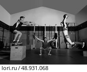 gym people group workout barbells slam balls and jump exercises. Стоковое фото, агентство Ingram Publishing / Фотобанк Лори