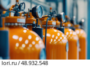 Orange gas tanks. Bundle of gas cylinder and high pressure gauges, meter, valve. Many argon cylinders with compressed oxygen for industry, welding. Fuel manufacturing. Liquefied gas production factory. Стоковое AI-изображение, AI-художник Марина Демидюк / Фотобанк Лори