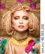 young woman with fashion makeup on brown background. Стоковое фото, агентство Ingram Publishing / Фотобанк Лори